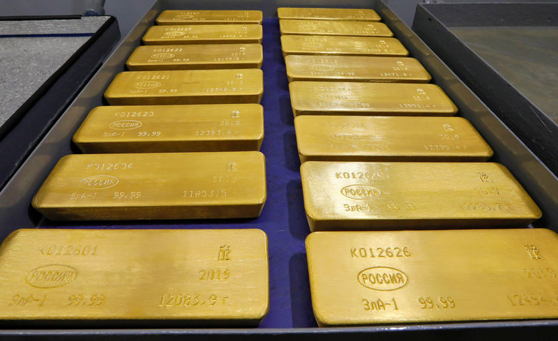 FILE PHOTO: Marked ingots of 99.99 percent pure gold are placed in a cart at a plant of Krastsvetmet in Krasnoyarsk